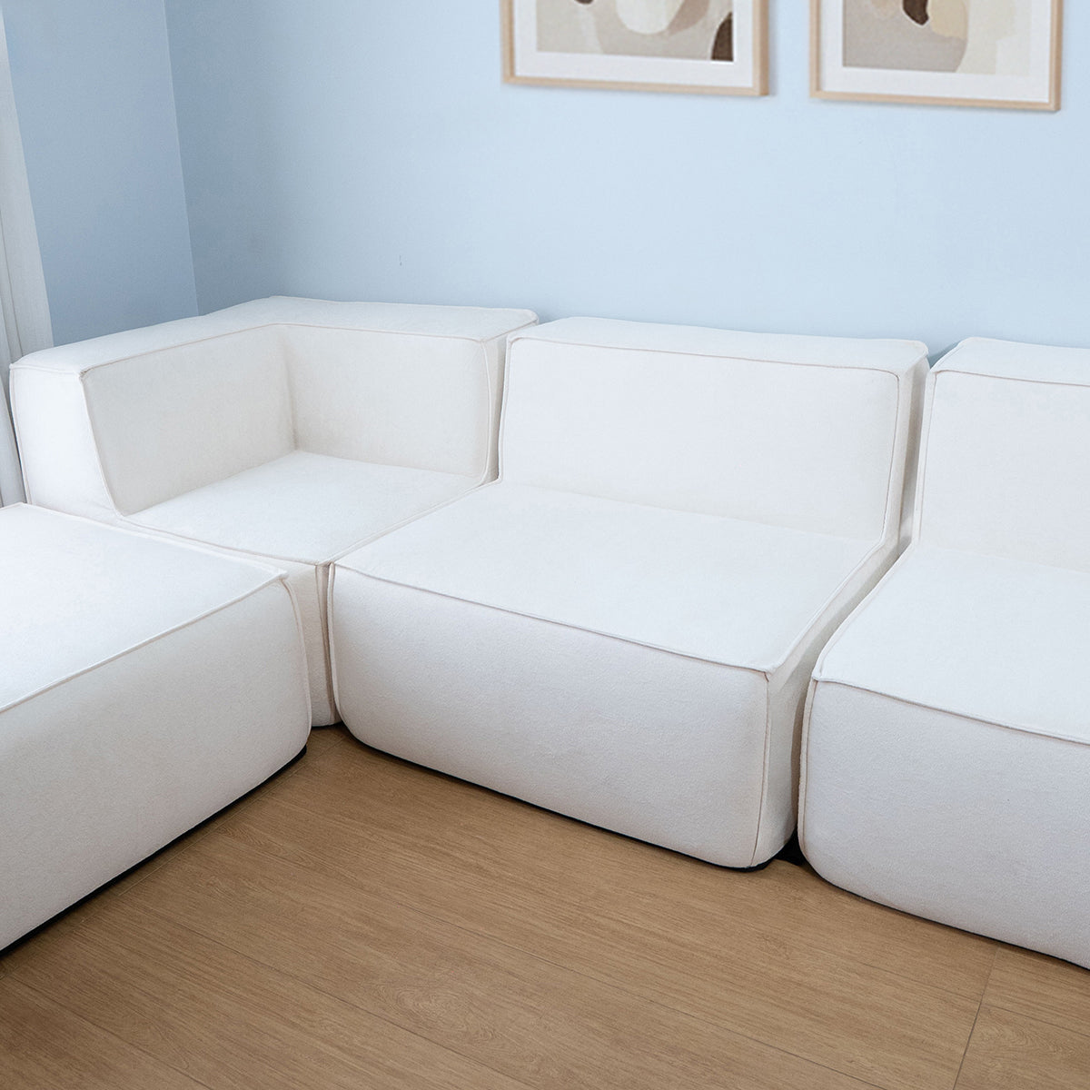 Sofá Modular Flow 4 Lugares 1 Canto com 1 Apoio de Pé em Boucle Bege